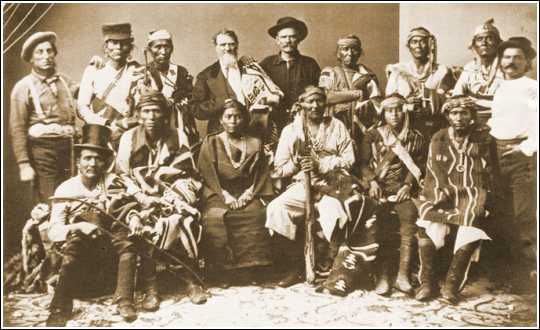 A delegation of Navajo representatives who traveled to Washington, D.C., in 1874 to discuss the provisions of the 1868 treaty with President Ulysses S. Grant. In actuality however, the purpose was to effect a land exchange by ceding the northern portion of the reservation bordering the San Juan River, where gold seekers were beginning to stake claims, for parcels of arid lands to the east and west.
President Grant met with the delegation on December 19, 1974, but the land exchange fell through, due mainly to the efforts of Thomas Keam, who had travelled to Washington at his own expense and shared the Navajos' desire to hold onto their lands.
The delegation consisted of (left to right, front row): Carnero Mucho, Mariano, Juanita (Manuelito's wife), Manuelito, Manuelito Segundo, and Tiene-su-se
Standing: 'Wild' Hank Sharp (Anglo), Ganado Mucho, Barbas Hueros, Agent Arny, Kentucky Mountain Bill (Anglo), Cabra Negra, Cayatanita, Narbona Primero, and Jesus Arviso, interpreter. 

