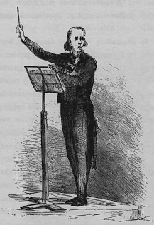 De dirigent aan het werk